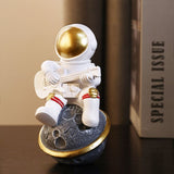 Figurine astronaute en résine jouant de la guitare
