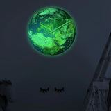 Horloge murale planète terre phosphorescente